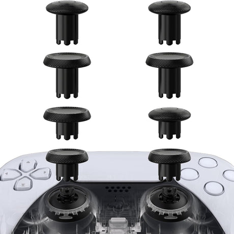 Black joystick caps on a gaming controller with a white background